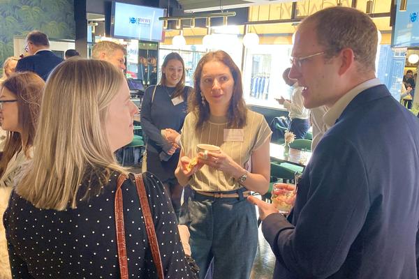 Business people talking over drinks